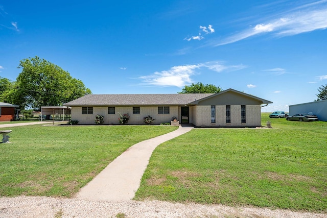 1201 New Hope Rd, Stamford, TX 79553 - single story home with a front lawn and brick siding