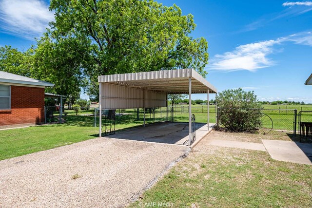 1201 New Hope Rd, Stamford, TX 79553 - view of parking / parking lot featuring driveway and a detached carport