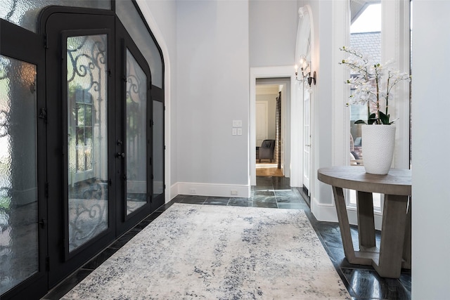 12229 Pecan Forest Dr, Dallas, TX 75230 - foyer featuring french doors and baseboards