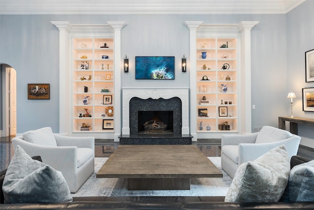 12229 Pecan Forest Dr, Dallas, TX 75230 - living area featuring a fireplace, ornamental molding, built in features, and arched walkways