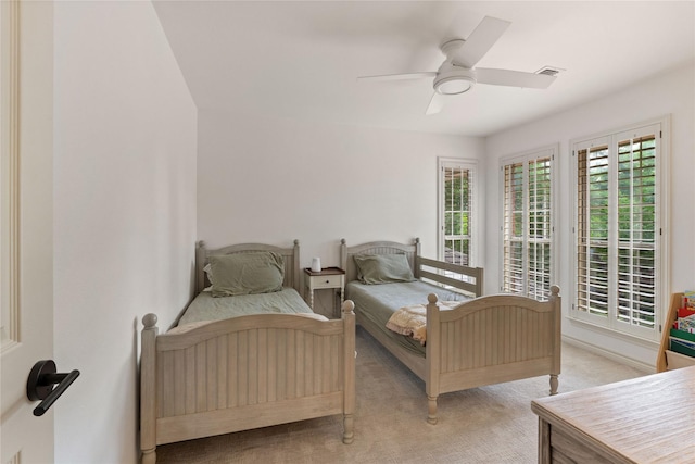 bedroom featuring carpet flooring, a ceiling fan, and access to outside