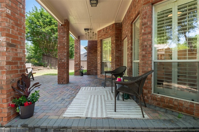 view of patio featuring fence