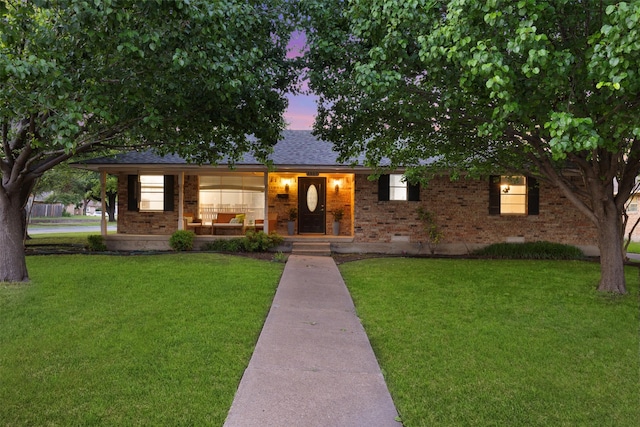 1317 Kingsbridge Dr, Garland, TX 75040 - single story home with brick siding, a front lawn, and a porch