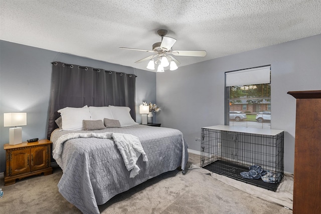 1317 Kingsbridge Dr, Garland, TX 75040 - carpeted bedroom featuring baseboards, a ceiling fan, and a textured ceiling
