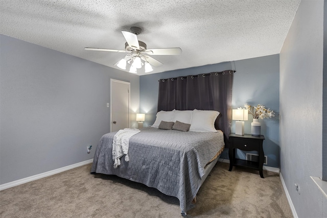 1317 Kingsbridge Dr, Garland, TX 75040 - carpeted bedroom featuring baseboards, a ceiling fan, and a textured ceiling