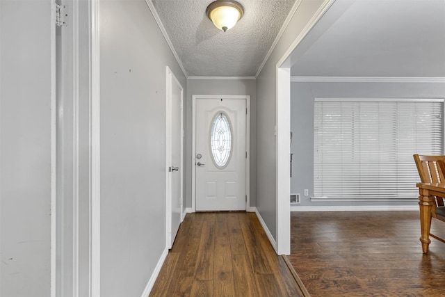 1317 Kingsbridge Dr, Garland, TX 75040 - foyer entrance featuring dark wood-style floors, a textured ceiling, and baseboards