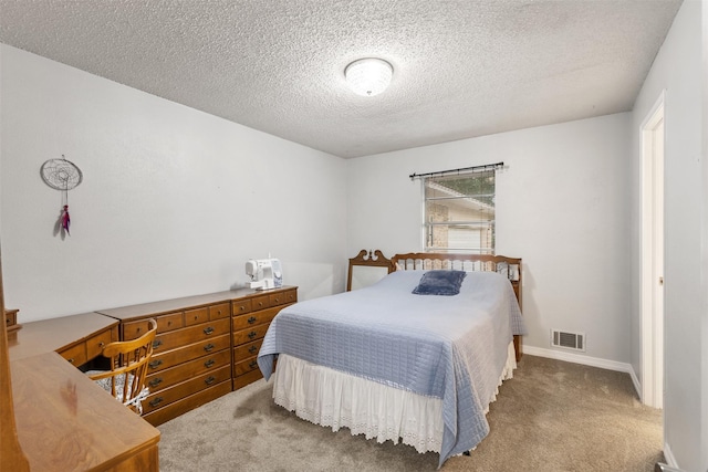 1317 Kingsbridge Dr, Garland, TX 75040 - carpeted bedroom with a textured ceiling