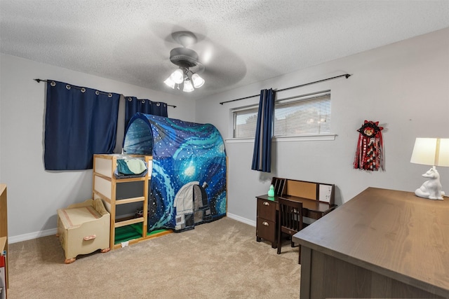 1317 Kingsbridge Dr, Garland, TX 75040 - carpeted bedroom featuring a textured ceiling, baseboards, and a ceiling fan