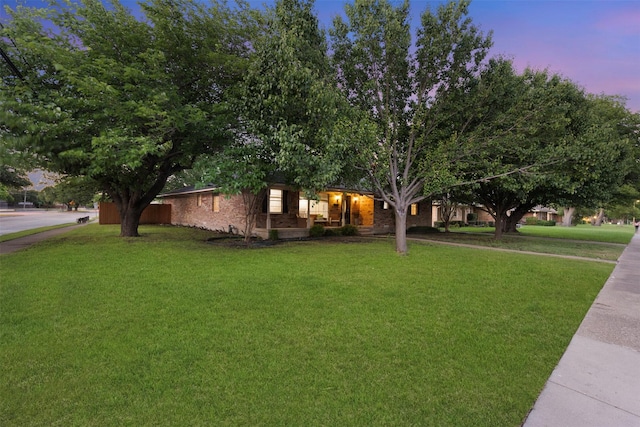 1317 Kingsbridge Dr, Garland, TX 75040 - view of front facade with a front yard