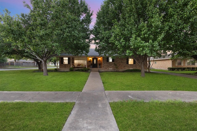 1317 Kingsbridge Dr, Garland, TX 75040 - ranch-style house featuring a lawn and brick siding