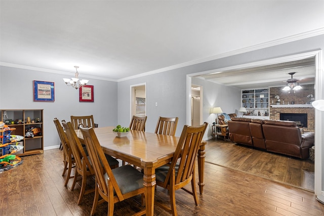 1317 Kingsbridge Dr, Garland, TX 75040 - dining area with wood-type flooring, a chandelier, ornamental molding, baseboards, and ceiling fan