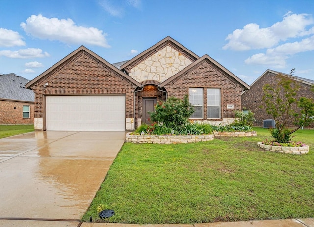 505 Pleasant Hill Ln, Fate, TX 75189 - view of front facade featuring an attached garage, brick siding, concrete driveway, and a front yard