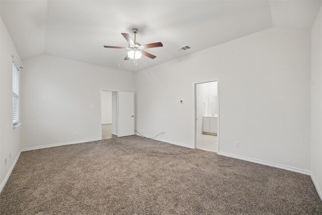 505 Pleasant Hill Ln, Fate, TX 75189 - unfurnished bedroom with carpet flooring, lofted ceiling, baseboards, connected bathroom, and a ceiling fan