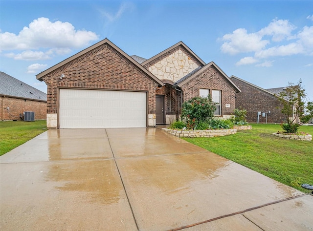 505 Pleasant Hill Ln, Fate, TX 75189 - french country style house with brick siding, a garage, a front yard, concrete driveway, and central AC unit