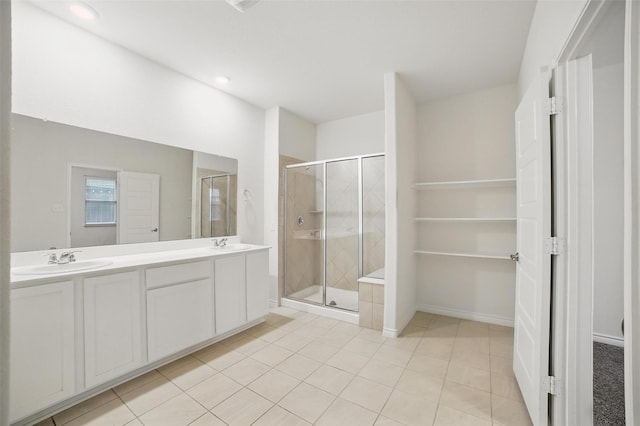 505 Pleasant Hill Ln, Fate, TX 75189 - full bath featuring a shower stall, double vanity, tile patterned flooring, recessed lighting, and baseboards