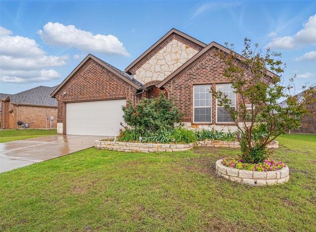 505 Pleasant Hill Ln, Fate, TX 75189 - view of front of home featuring brick siding, an attached garage, concrete driveway, and a front lawn