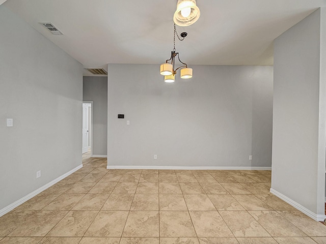 unfurnished room with light tile patterned floors, a chandelier, and baseboards