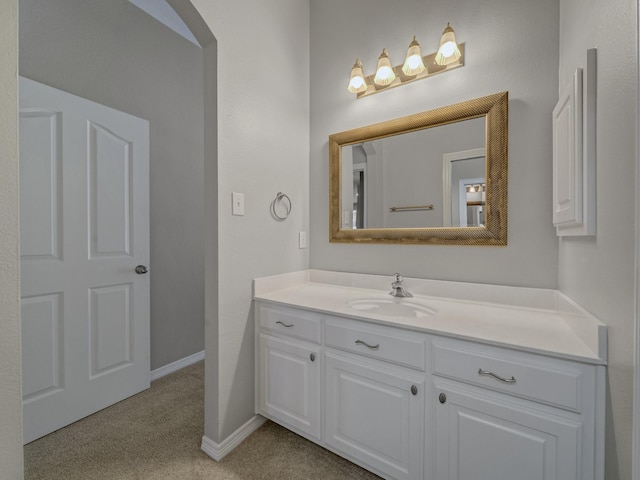 bathroom featuring vanity and baseboards