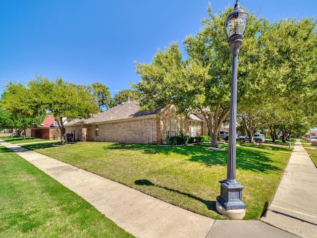 view of property's community featuring a yard