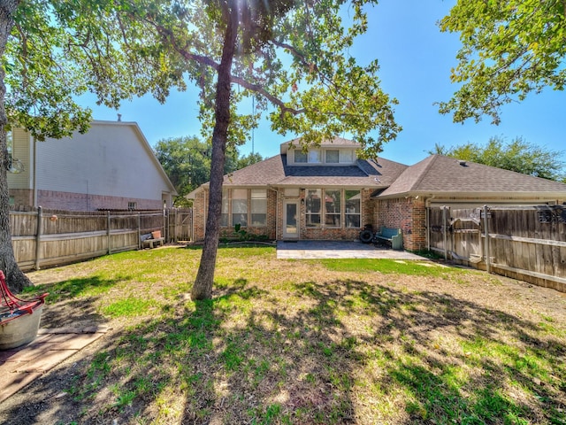 back of house featuring brick siding, a patio area, and a shingled roof
