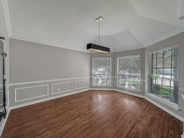 unfurnished dining area with ornamental molding, wood finished floors, and lofted ceiling