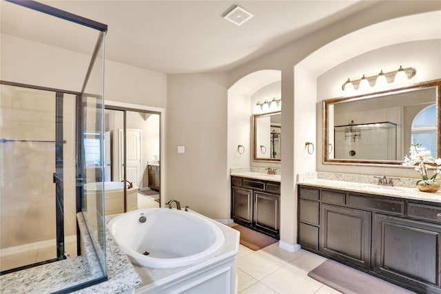 8205 Saint Clair Dr, Mckinney, TX 75071 - bathroom with a stall shower, a bath, tile patterned floors, and two vanities