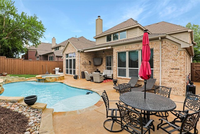 8205 Saint Clair Dr, Mckinney, TX 75071 - back of house featuring brick siding, a fenced backyard, a patio area, and a pool with connected hot tub
