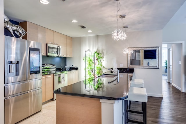 1200 Main St Unit 809, Dallas, TX 75202 - kitchen with stainless steel appliances, dark countertops, a sink, recessed lighting, and modern cabinets