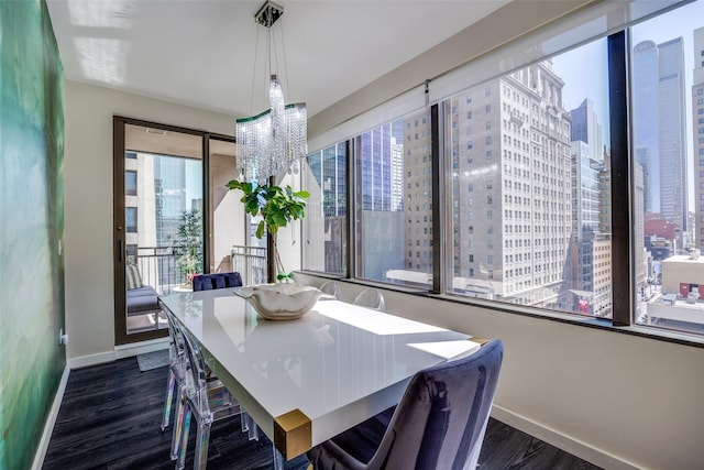 1200 Main St Unit 809, Dallas, TX 75202 - dining space with baseboards, a view of city, and dark wood-type flooring