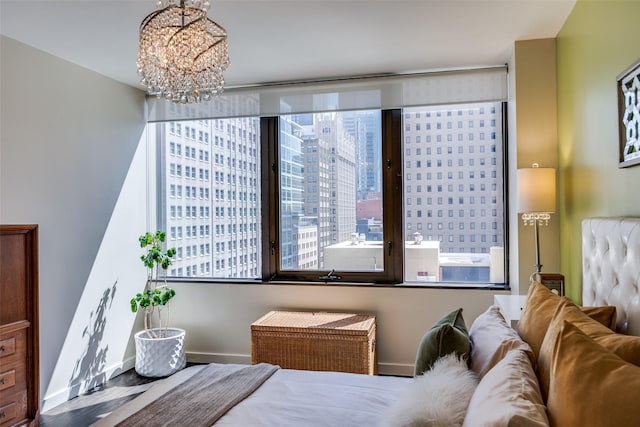 1200 Main St Unit 809, Dallas, TX 75202 - bedroom featuring a chandelier and baseboards