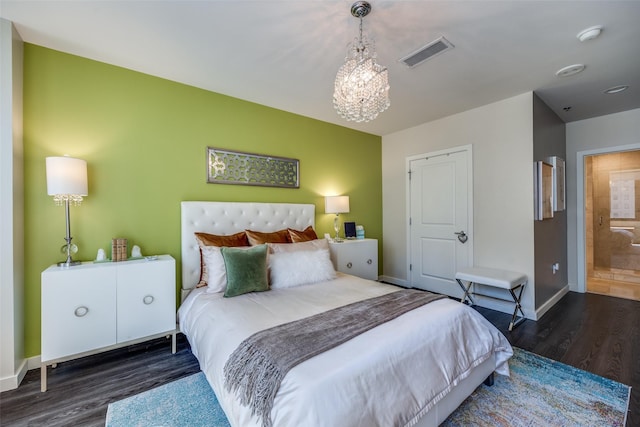 1200 Main St Unit 809, Dallas, TX 75202 - bedroom featuring wood finished floors, a chandelier, and baseboards