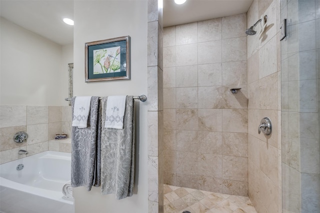 1200 Main St Unit 809, Dallas, TX 75202 - bathroom with a shower stall, a garden tub, and recessed lighting