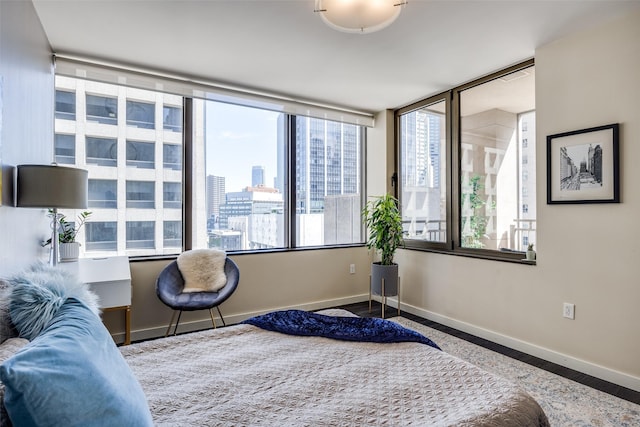 1200 Main St Unit 809, Dallas, TX 75202 - bedroom with baseboards and a city view
