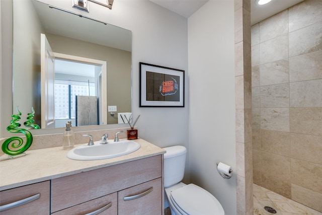 1200 Main St Unit 809, Dallas, TX 75202 - full bath featuring a tile shower, vanity, and toilet