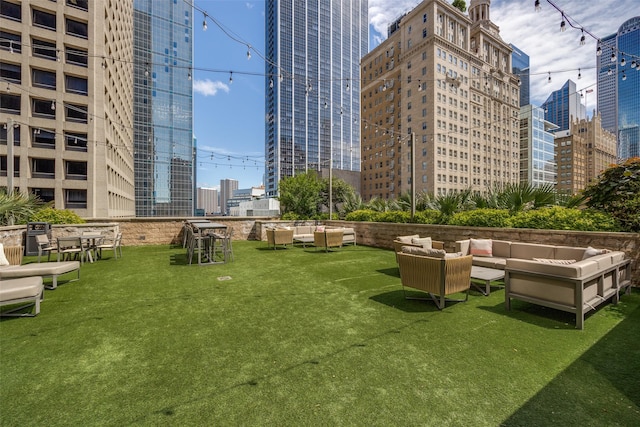 1200 Main St Unit 809, Dallas, TX 75202 - surrounding community featuring an outdoor living space, a view of city, and a yard