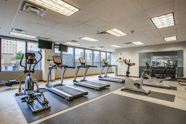 1200 Main St Unit 809, Dallas, TX 75202 - gym with a paneled ceiling and baseboards