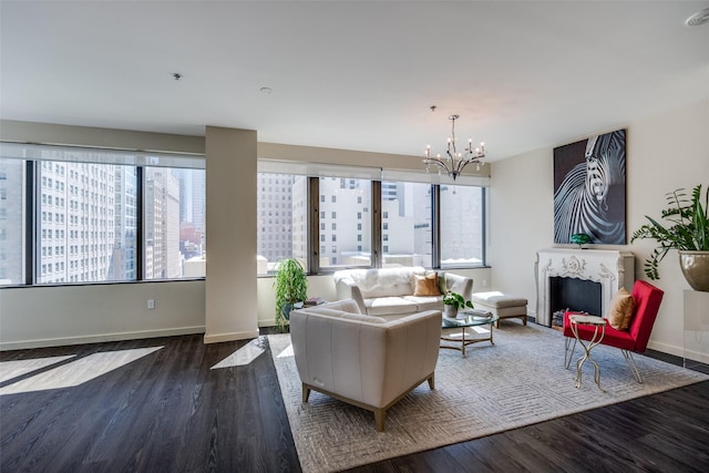 1200 Main St Unit 809, Dallas, TX 75202 - living area featuring wood finished floors, a chandelier, a fireplace, and baseboards