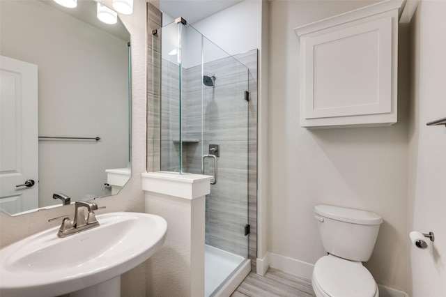 6725 Palmdale Dr, Fort Worth, TX 76123 - full bathroom with a sink, a stall shower, toilet, and baseboards