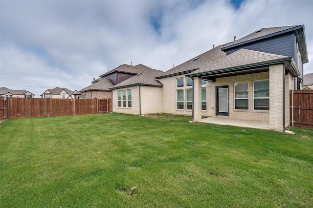 6725 Palmdale Dr, Fort Worth, TX 76123 - rear view of property with a patio, a shingled roof, and brick siding
