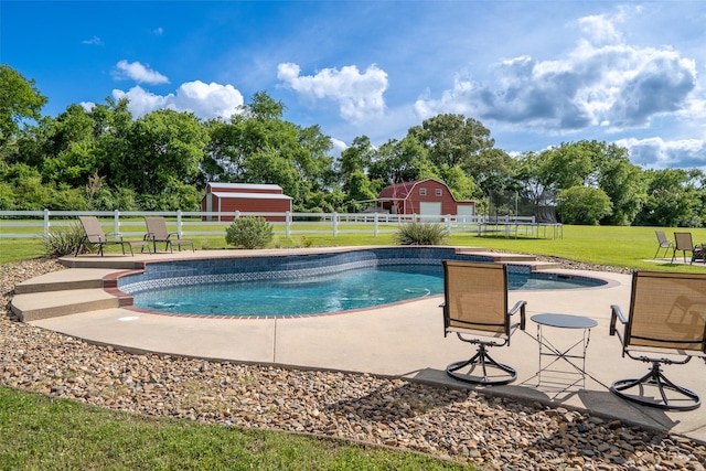 1020 High Meadow Dr, Mount Vernon, TX 75457 - view of pool featuring a storage unit, an outbuilding, a trampoline, a patio area, and view of wooded area