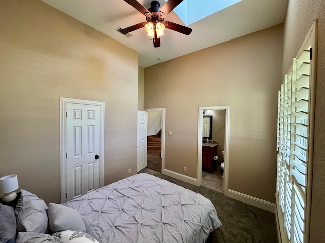 1020 High Meadow Dr, Mount Vernon, TX 75457 - bedroom with high vaulted ceiling, dark carpet, baseboards, ensuite bathroom, and ceiling fan