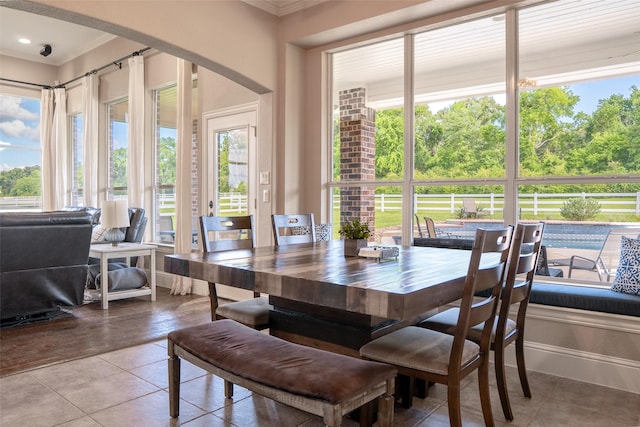 1020 High Meadow Dr, Mount Vernon, TX 75457 - dining room with crown molding, plenty of natural light, arched walkways, and tile patterned floors