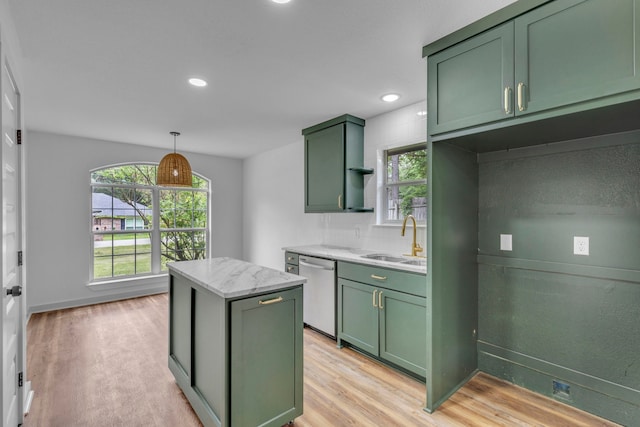 15630 Brittain Ct, Lindale, TX 75771 - kitchen with green cabinets, stainless steel dishwasher, a sink, light wood finished floors, and recessed lighting