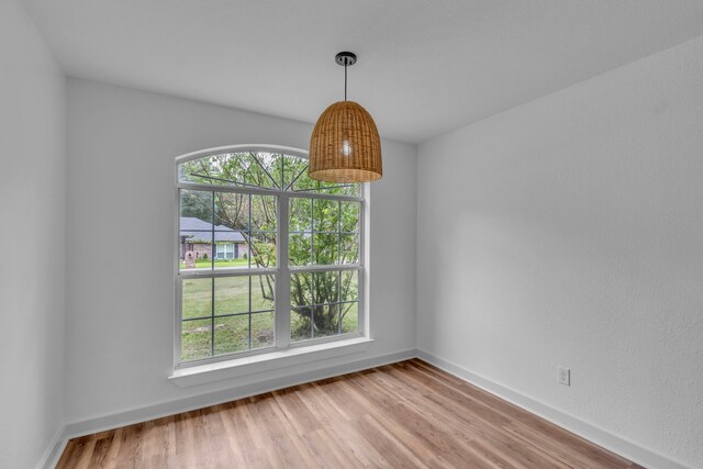 15630 Brittain Ct, Lindale, TX 75771 - unfurnished dining area with light wood-type flooring and baseboards