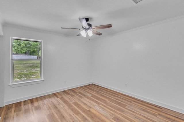 15630 Brittain Ct, Lindale, TX 75771 - spare room with crown molding, light wood-style floors, a ceiling fan, and baseboards