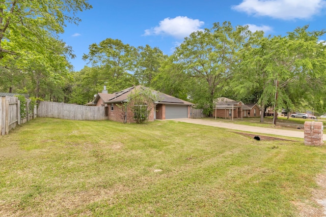 15630 Brittain Ct, Lindale, TX 75771 - view of yard with concrete driveway and an attached garage