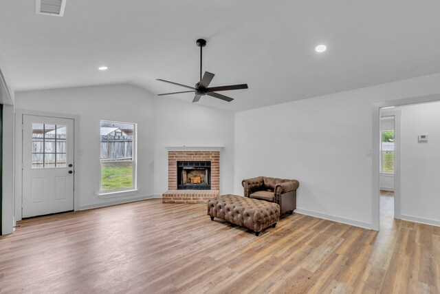 15630 Brittain Ct, Lindale, TX 75771 - sitting room with vaulted ceiling, a ceiling fan, light wood finished floors, a brick fireplace, and recessed lighting