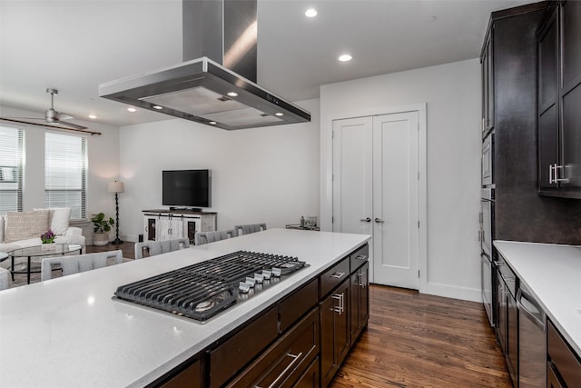 5816 Lindell Ave Unit 3, Dallas, TX 75206 - kitchen with island exhaust hood, light countertops, dark wood-style floors, baseboards, and recessed lighting