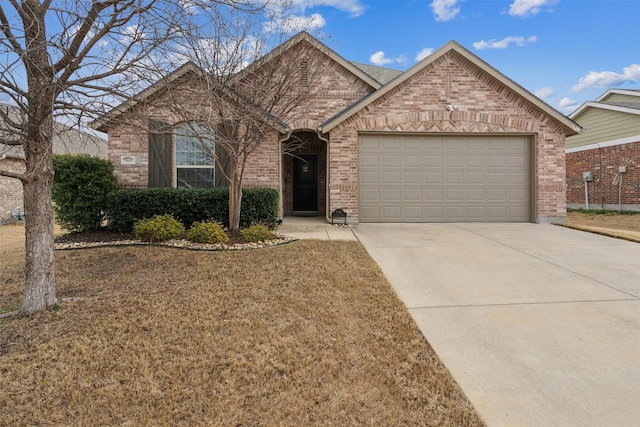 8332 Trickham Bnd, Fort Worth, TX 76131 - view of front of house featuring a garage, brick siding, and driveway