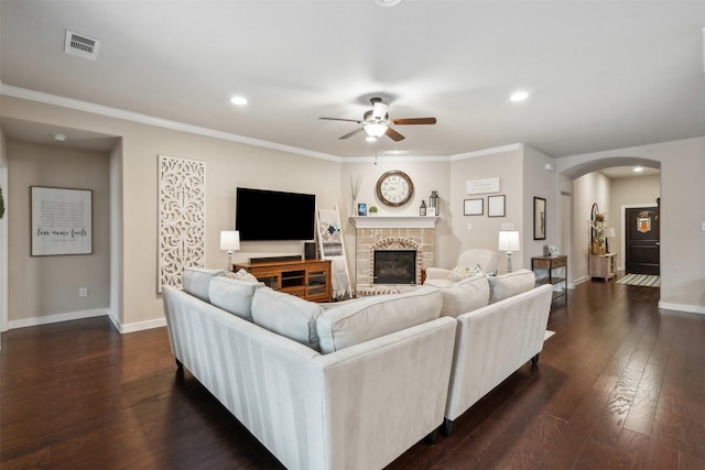 8332 Trickham Bnd, Fort Worth, TX 76131 - living room with ceiling fan, arched walkways, dark wood finished floors, a fireplace, and recessed lighting
